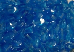 #15 - 50 Stck. Pinch-Bead 5x3mm - tr./opal sapphire