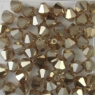 #10 25 Stück - 6,0 mm Crystal Bicone topaz gold lustered