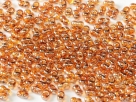 #56.00 - 10 g cz. Farfalle 4x2 mm tr.crystal full apricot med